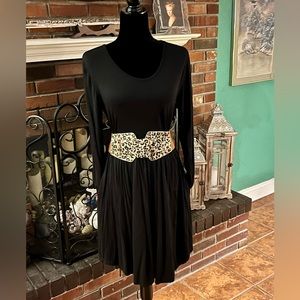 Rayon dress with belt and pockets.